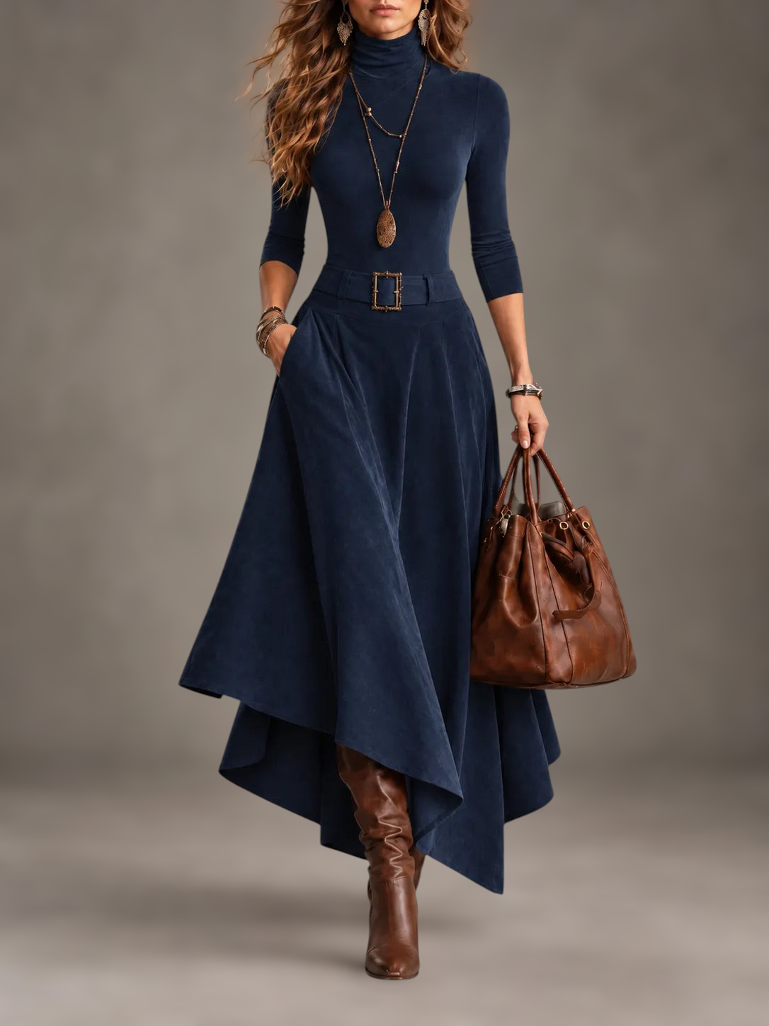 Completo due pezzi Alessia Vellani blu con top a collo alto, gonna midi asimmetrica e cintura in vita