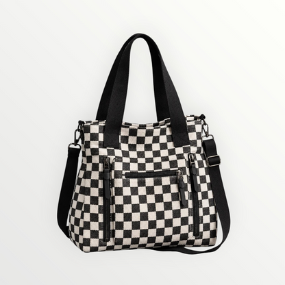 Borsa shopper Alessia Vellani a scacchiera bianca e nera con tasche frontali con zip e tracolla regolabile